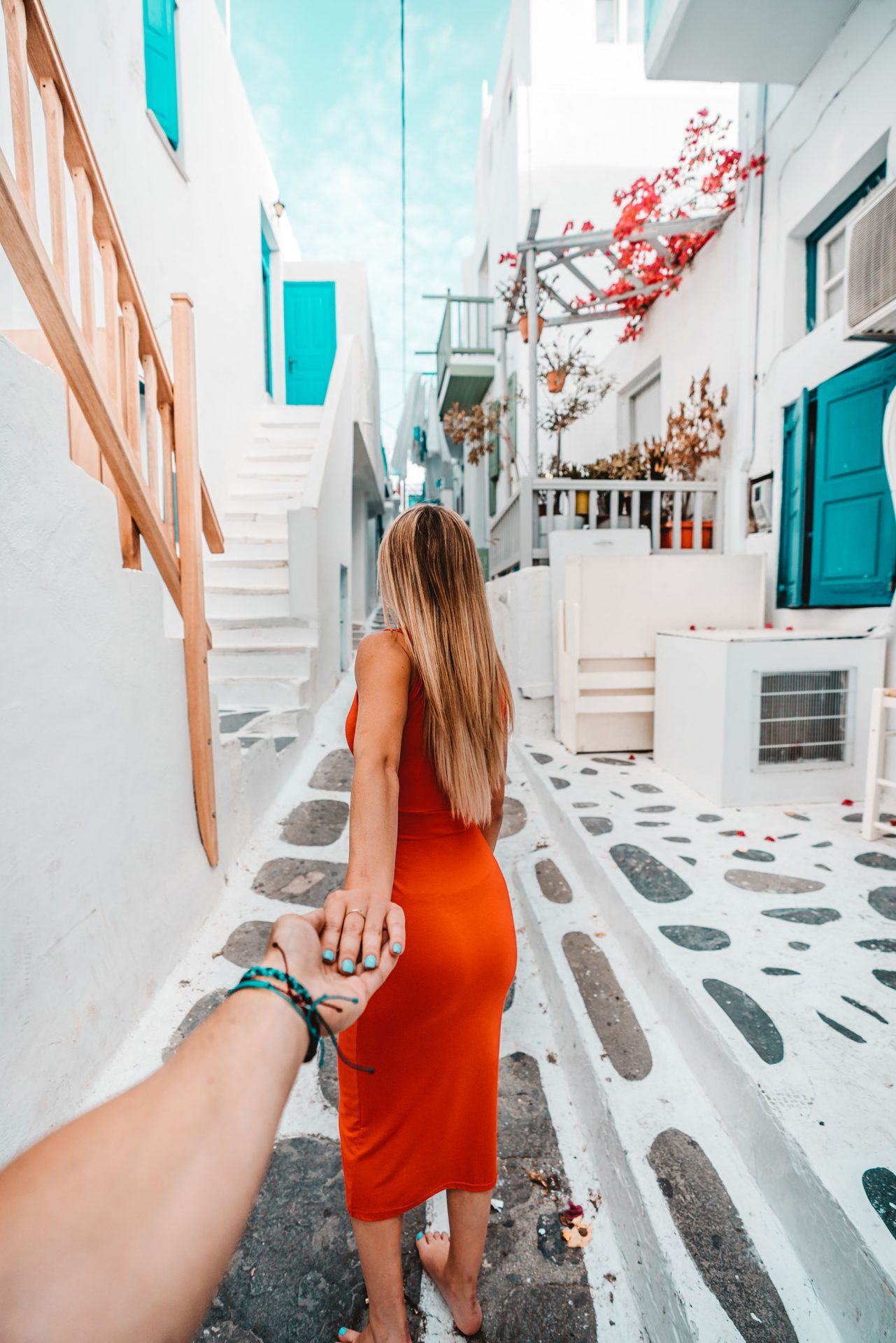Girl in a Red Dress Holding Picture Taker's Hand