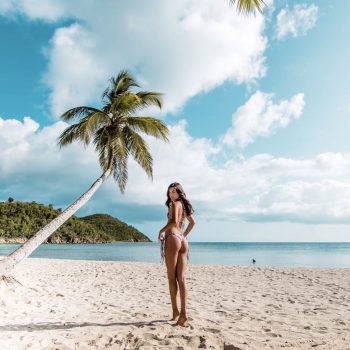 Girl on Tropical Beach With Palm Tree